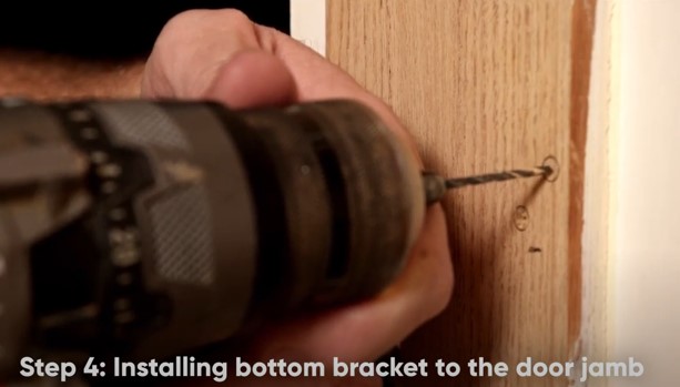 install bottom brackey to door jamb